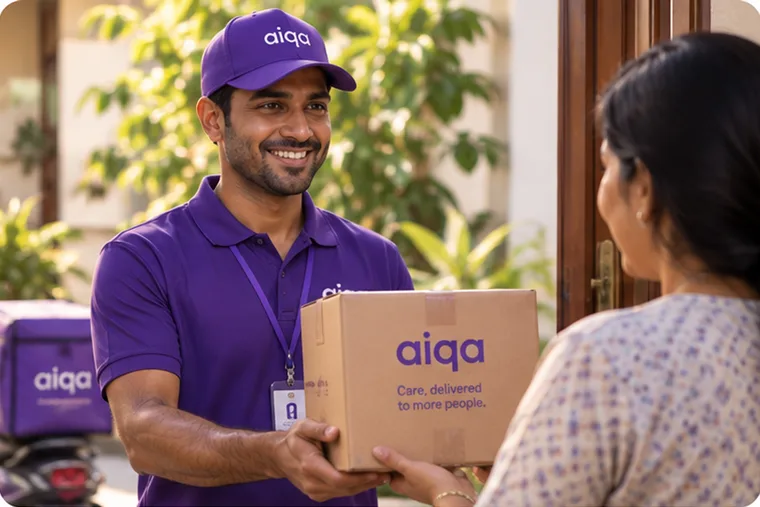 An aiqa delivery rider handing a medicine parcel to a member at her front door.